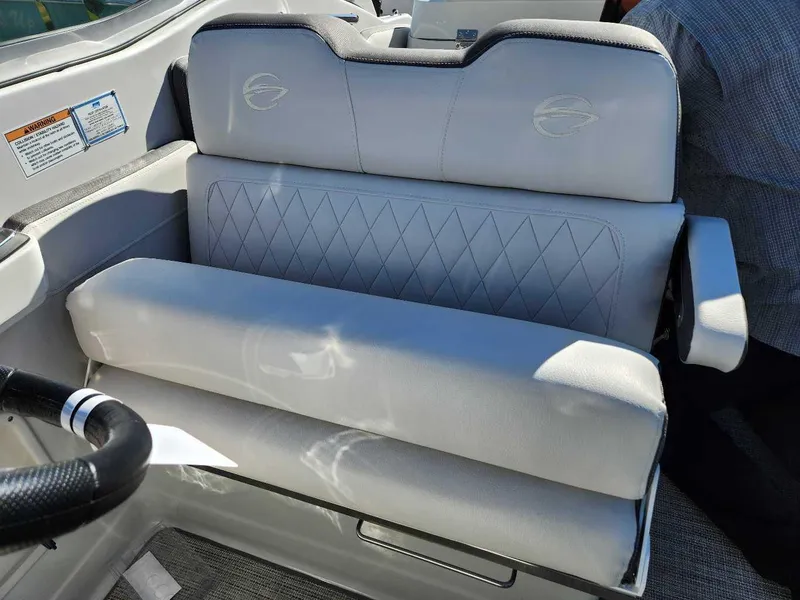Slide: The Image of 2024 Crownline 280 CRX boat interior seating with diamond-stitched upholstery. - 18