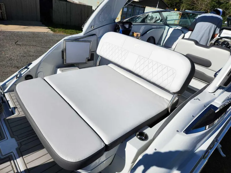 Slide: The Image of 2024 Crownline 280 CRX boat interior with white cushioned seating. - 20