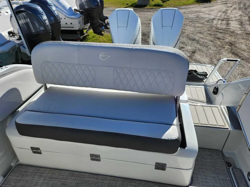 Slide: The Image of 2024 Crownline 280 CRX boat with Yamaha engines, featuring a cushioned rear bench seat. - 21