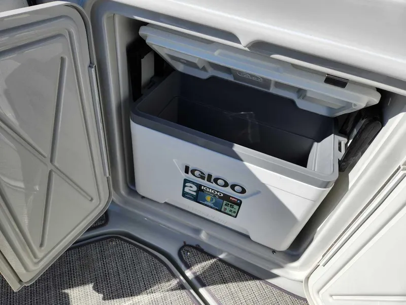 Slide: The Image of Built-in cooler compartment on the 2024 Crownline 280 CRX boat. - 24