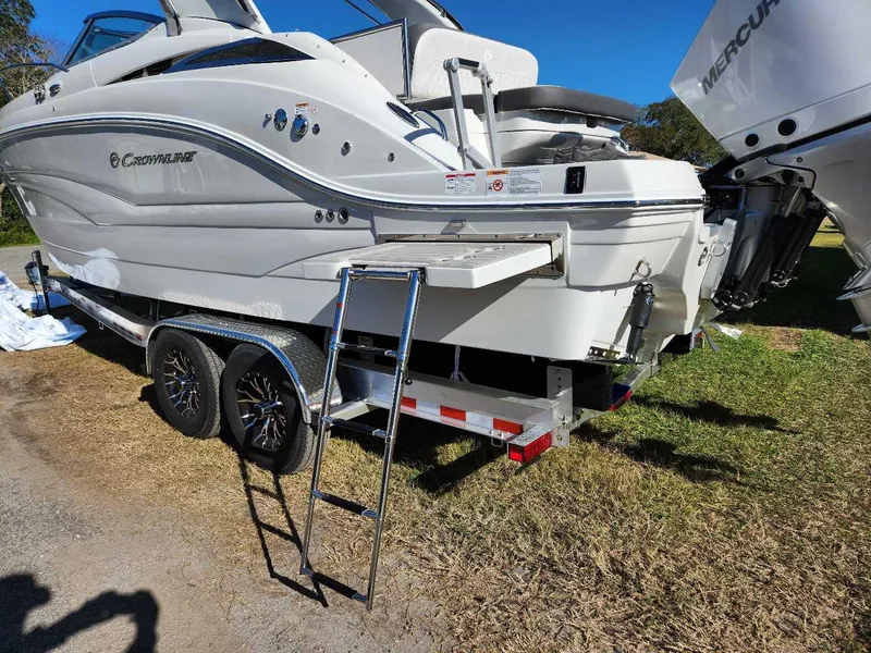 Slide: The Image of 2024 Crownline 280 CRX boat on trailer with ladder, rear view. - 25