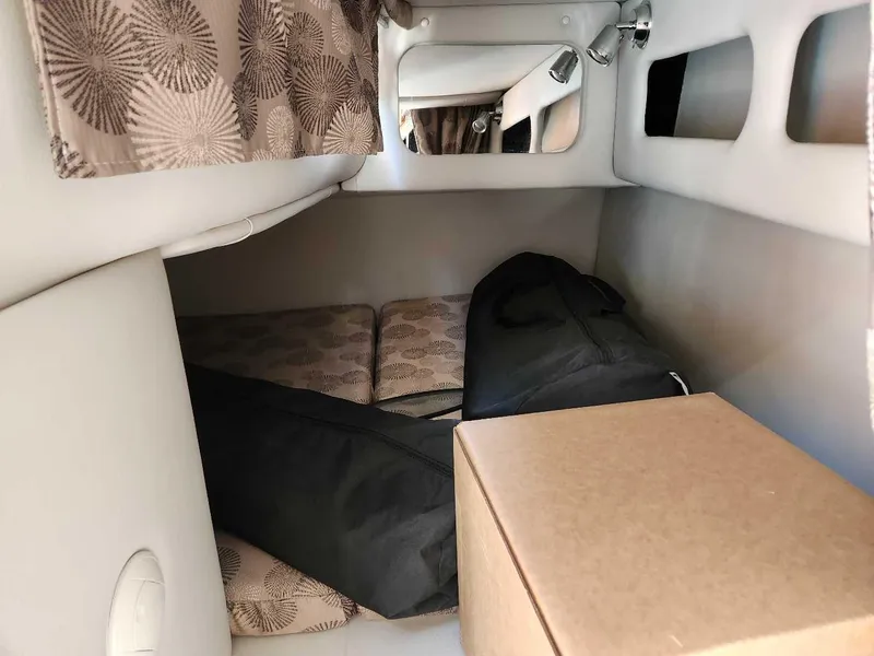 Slide: The Image of Interior cabin of 2024 Crownline 280 CRX boat with storage items. - 9