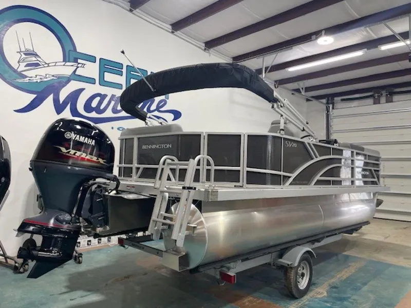 Slide: The Image of 2024 Bennington 20 SVL pontoon boat with Yamaha engine in showroom. - 12