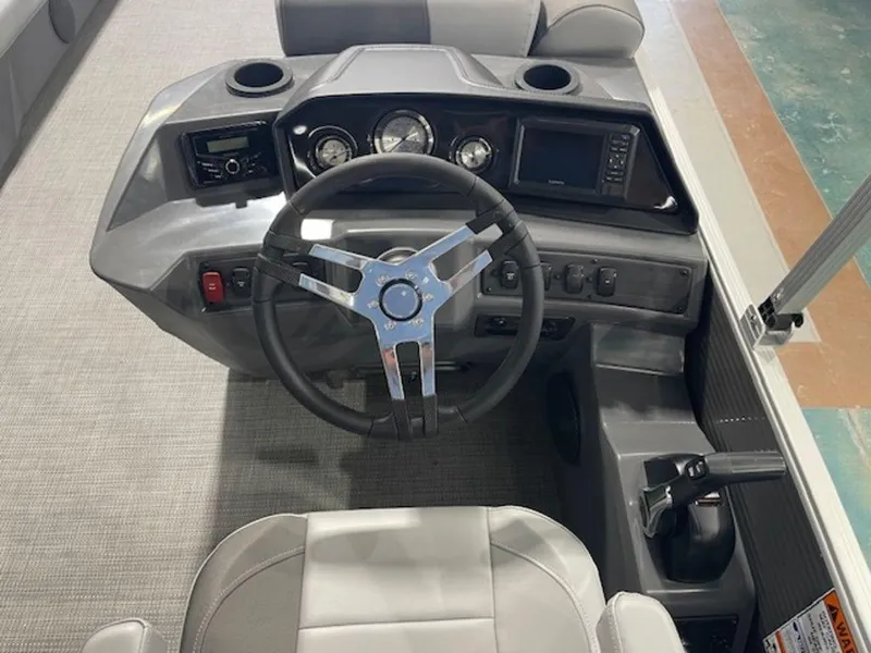 Slide: The Image of 2024 Bennington 20 SVL boat dashboard with steering wheel and control panel. - 4