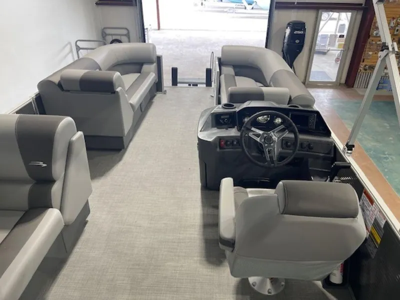 Slide: The Image of 2024 Bennington 20 SVL pontoon boat interior with gray seating and steering console. - 5