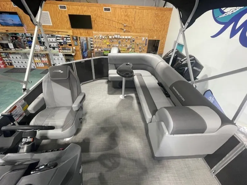 Slide: The Image of 2024 Bennington 20 SVL pontoon boat interior with gray seating and helm. - 6