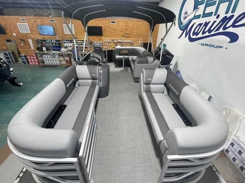 Slide: The Image of 2024 Bennington 20 SVL pontoon boat interior with gray seating and canopy. - 7
