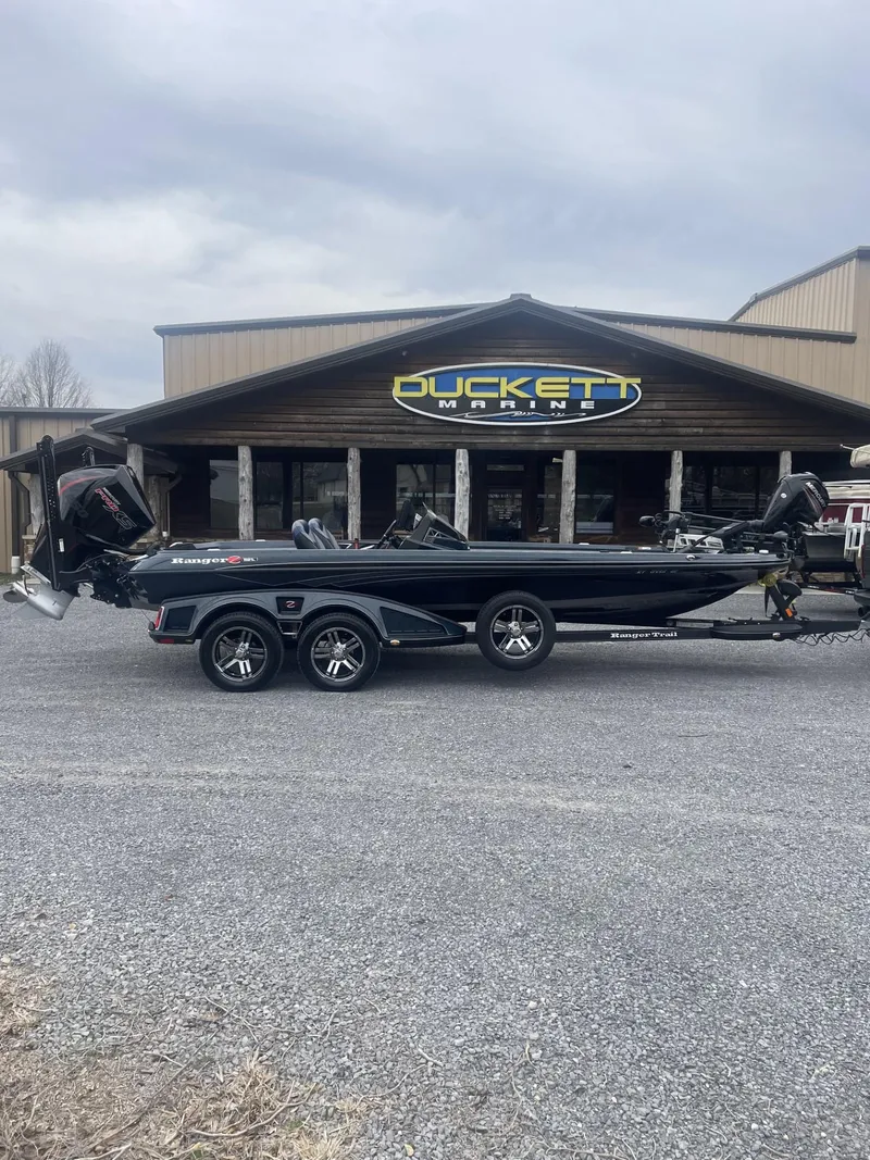 The Image of 2021 Ranger Z521L bass boat parked in front of Duckett Marine store. - 1