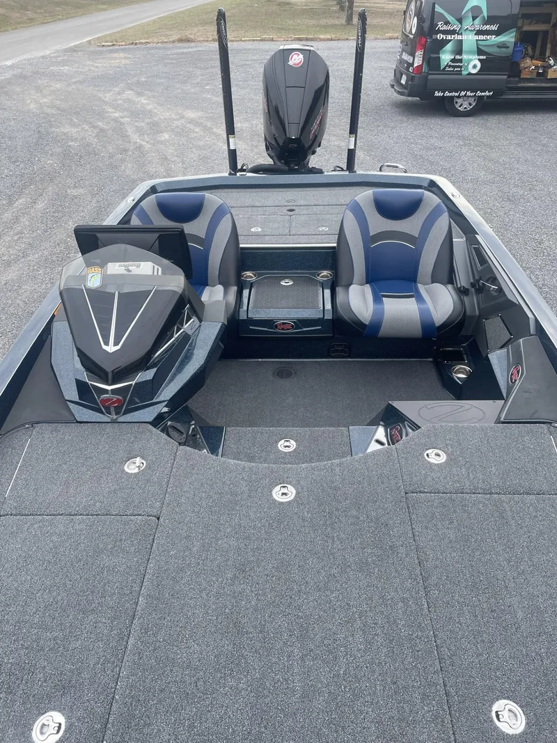 Slide: The Image of 2021 Ranger Z521L fishing boat with dual seats and modern dashboard. - 3