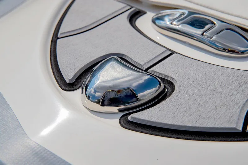 Slide: The Image of Close-up of Zodiac Yachline 400 2024 boat's sleek chrome and white deck design. - 5