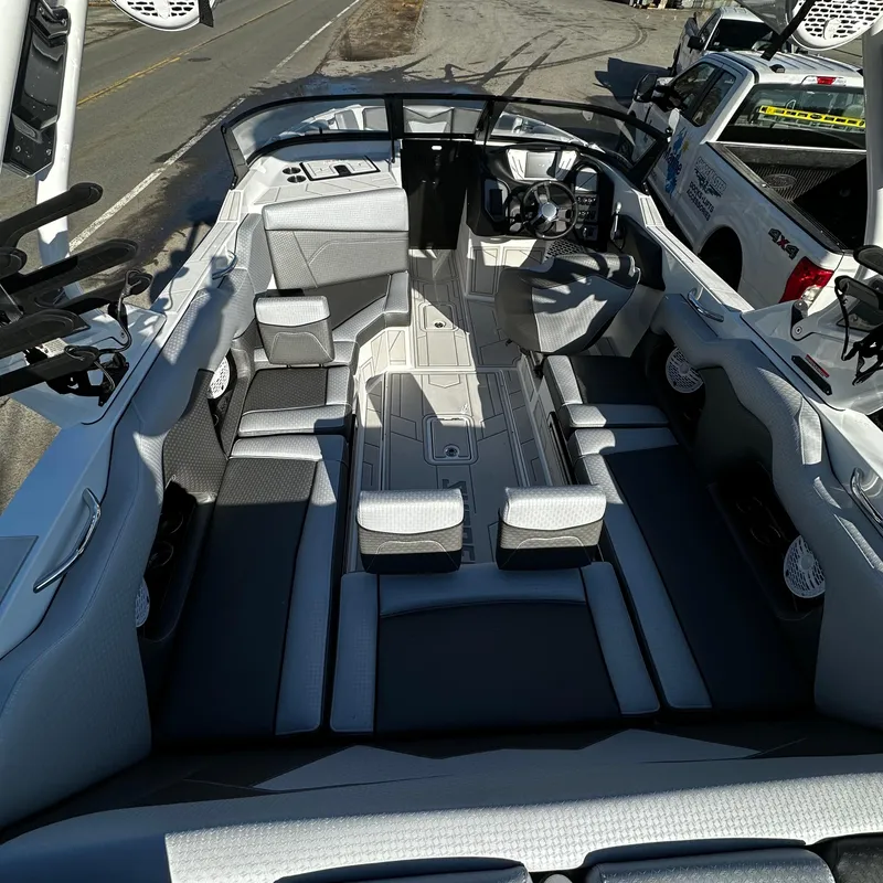 Slide: The Image of 2023 Supreme ZS232 boat interior with spacious seating and modern dashboard. - 5