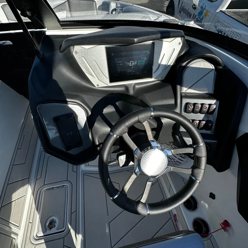 Slide: The Image of 2023 Supreme ZS232 boat dashboard with touchscreen display and modern steering wheel. - 7