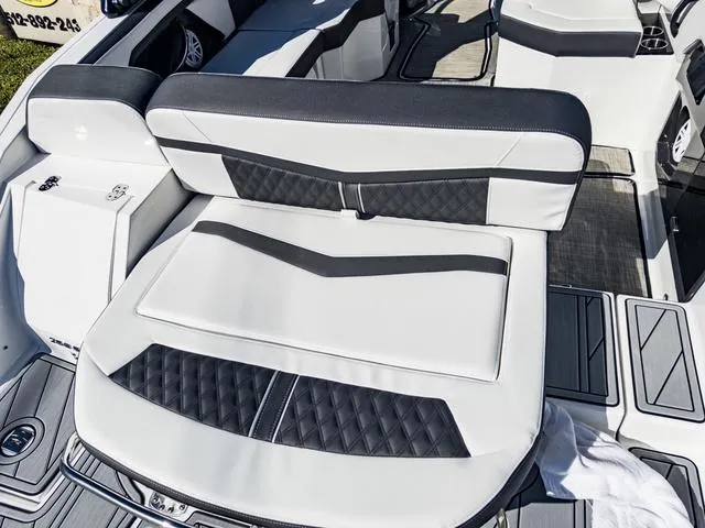 Slide: The Image of 2024 Monterey 258 SS boat interior with white and black seating. - 14