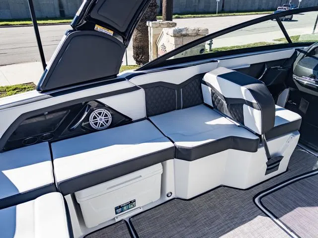 Slide: The Image of 2024 Monterey 258 SS boat interior with cushioned seating and built-in speaker. - 20