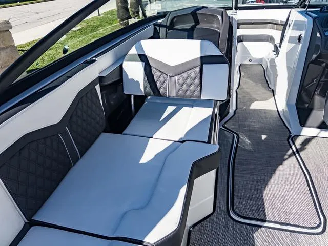 Slide: The Image of 2024 Monterey 258 SS boat interior with luxurious seating and modern design. - 23