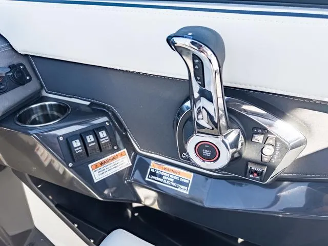 Slide: The Image of 2024 Monterey 258 SS boat control panel with throttle and switches. - 25
