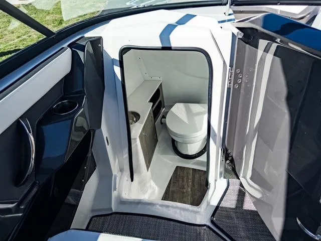 Slide: The Image of 2024 Monterey 258 SS boat interior with compact bathroom. - 32