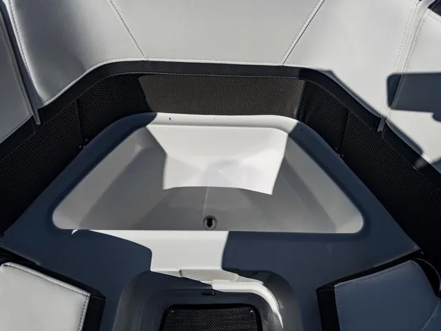 Slide: The Image of 2024 Monterey 258 SS boat interior seating area with storage compartment. - 39