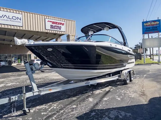 Slide: The Image of 2024 Monterey 258 SS boat on trailer outside dealership. - 4