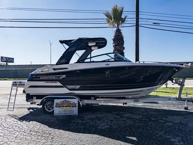 Slide: The Image of 2024 Monterey 258 SS boat on a trailer in a parking lot. - 46