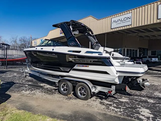 Slide: The Image of 2024 Monterey 258 SS boat on trailer outside Avalon dealership. - 7