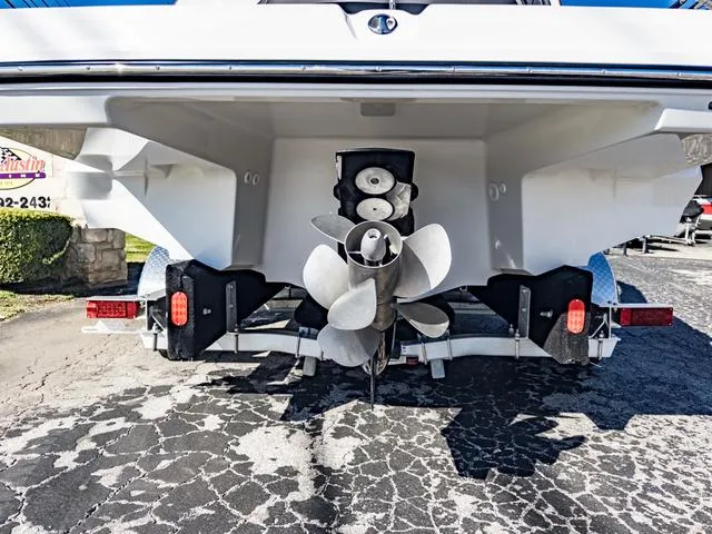 Slide: The Image of 2024 Monterey 258 SS boat stern with dual propellers on a trailer. - 8