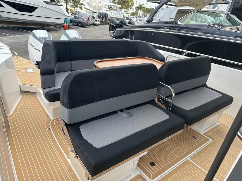 Slide: The Image of Luxury seating area on the 2024 Nimbus Tender 11 #258 boat. - 13