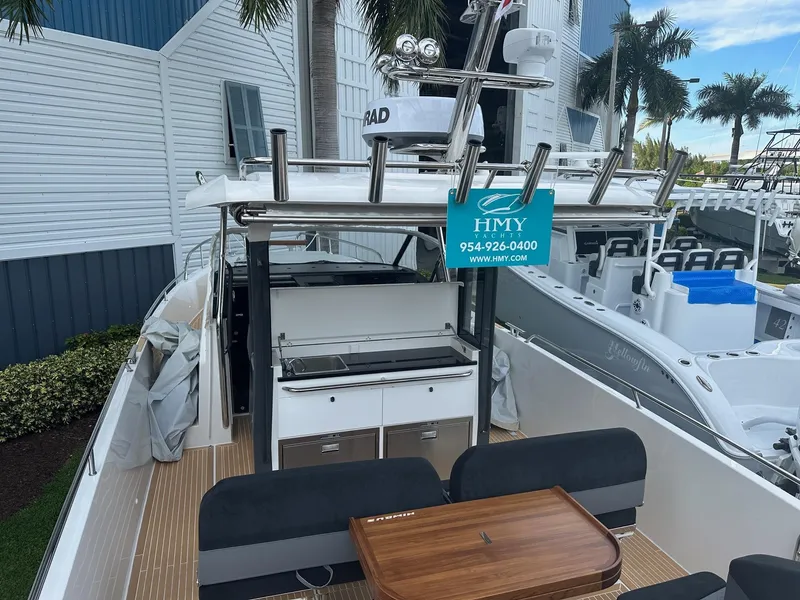 Slide: The Image of 2024 Nimbus Tender 11 #258 boat with outdoor seating and kitchen area. - 16