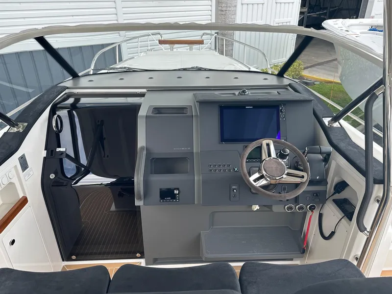 Slide: The Image of Cockpit of 2024 Nimbus Tender 11 #258 with modern navigation system and steering wheel. - 19