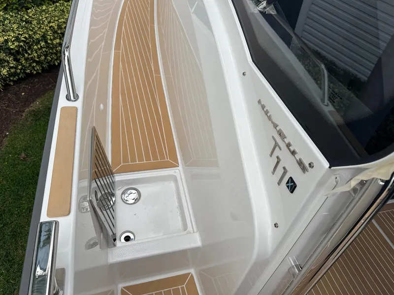 Slide: The Image of 2024 Nimbus Tender 11 #258 boat deck with teak flooring. - 25