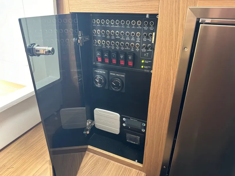 Slide: The Image of Electrical control panel inside 2024 Nimbus Tender 11 #258 boat. - 30