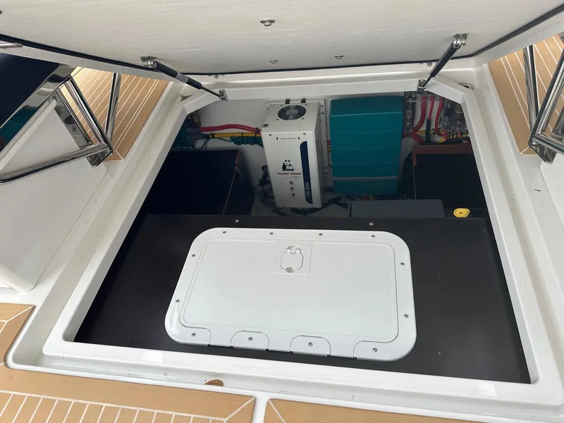 Slide: The Image of Engine compartment of 2024 Nimbus Tender 11 #258 with open hatch. - 35