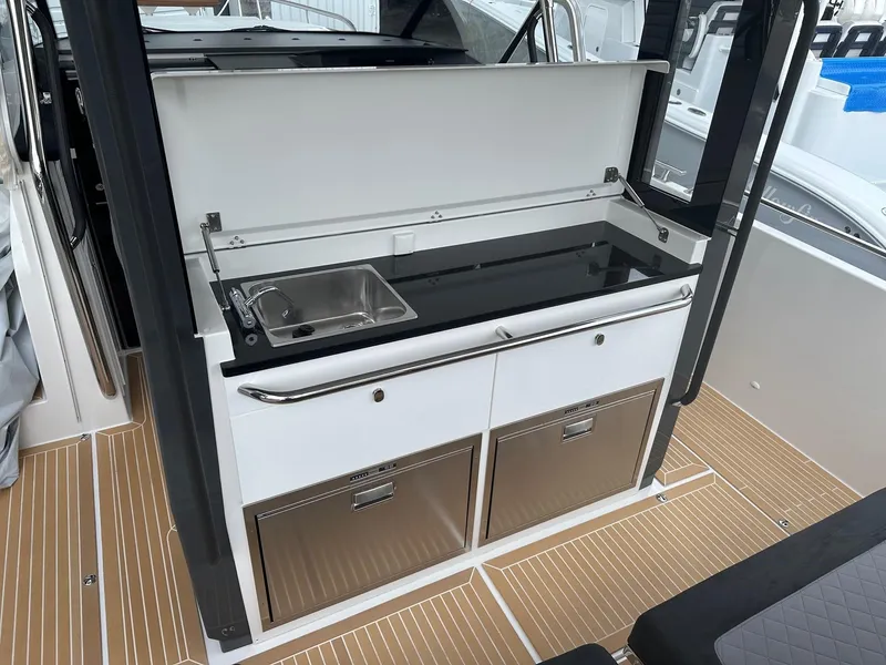 Slide: The Image of Outdoor kitchenette on the 2024 Nimbus Tender 11 #258 boat. - 36