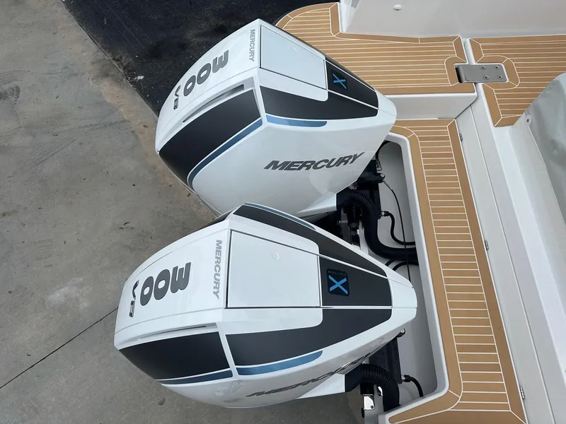 Slide: The Image of Twin Mercury outboard engines on a 2024 Nimbus Tender 11 #258 boat. - 6