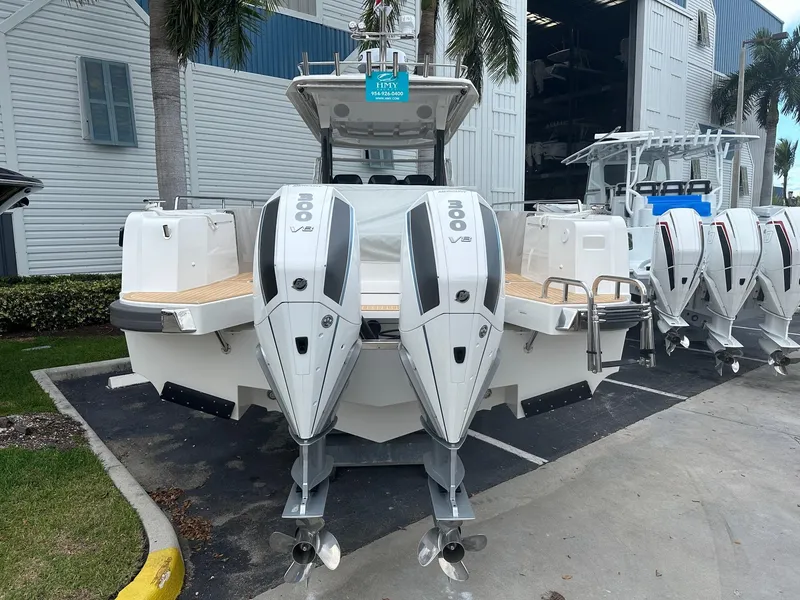 Slide: The Image of 2024 Nimbus Tender 11 #258 with dual outboard engines in a marina. - 9