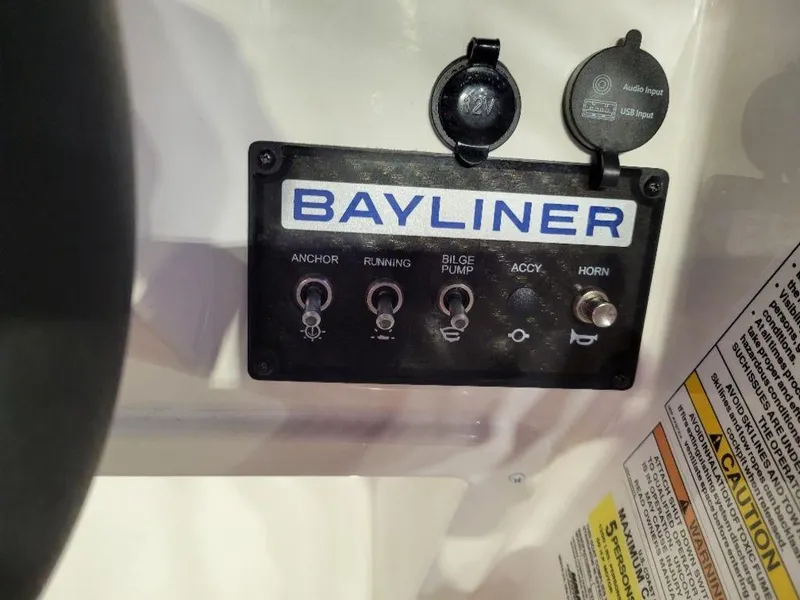 Slide: The Image of Control panel of a 2024 Bayliner M15 boat with labeled switches. - 1