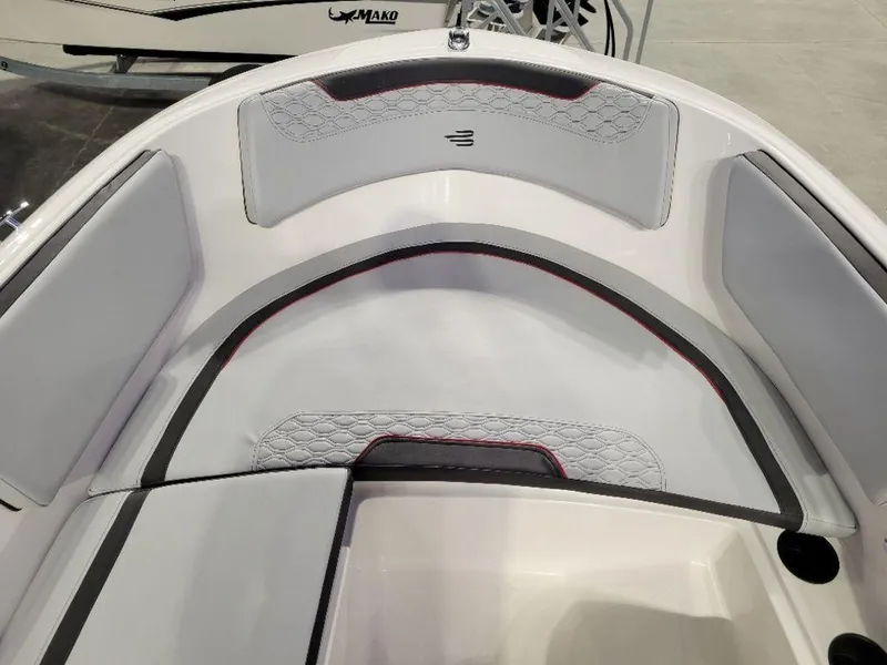 Slide: The Image of 2024 Bayliner M15 boat interior seating area with cushioned seats and modern design. - 6