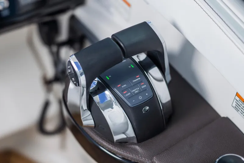 Slide: The Image of Throttle controls of 2024 Sea Ray Sundancer 320 Outboard boat, featuring modern design. - 19