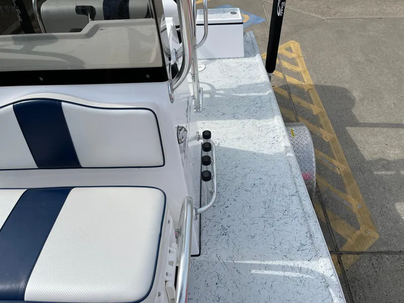 Slide: The Image of 2024 Shallow Stalker SS-17 Sportsman boat interior with white and blue seating. - 14