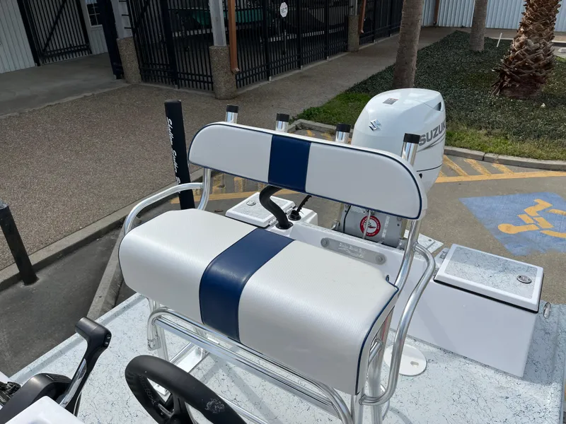 Slide: The Image of 2024 Shallow Stalker SS-17 Sportsman boat with Suzuki outboard motor and white-blue seating. - 15