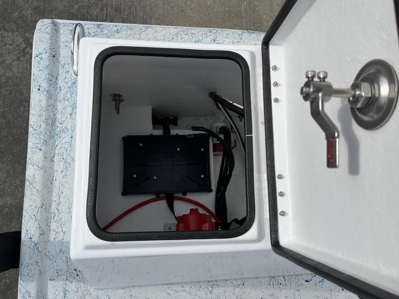 Slide: The Image of 2024 Shallow Stalker SS-17 Sportsman storage compartment with wiring and battery. - 19