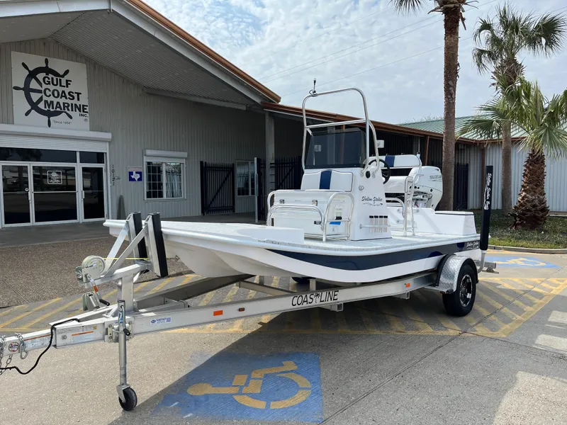 Slide: The Image of 2024 Shallow Stalker SS-17 Sportsman boat on trailer at Gulf Coast Marine dealership. - 2