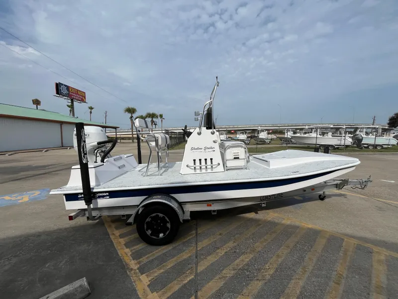 Slide: The Image of 2024 Shallow Stalker SS-17 Sportsman boat on trailer in parking lot. - 5