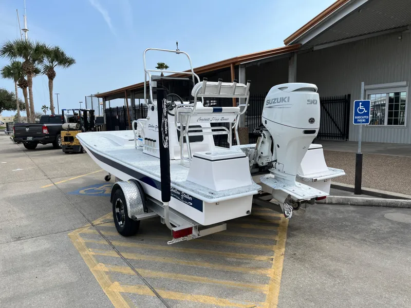 Slide: The Image of 2024 Shallow Stalker SS-17 Sportsman boat with Suzuki engine on trailer in parking lot. - 8