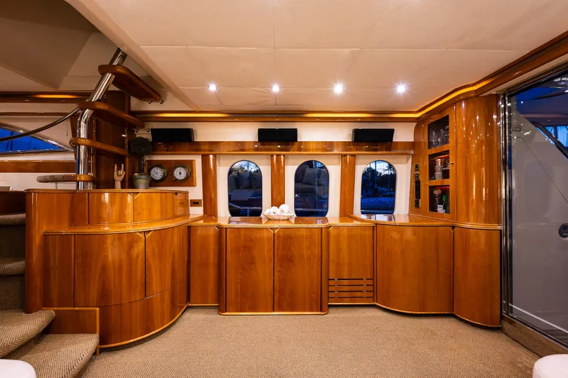 Slide: The Image of Luxurious interior of a 2002 Viking Princess 72 SportCruiser yacht with wooden cabinetry. - 35
