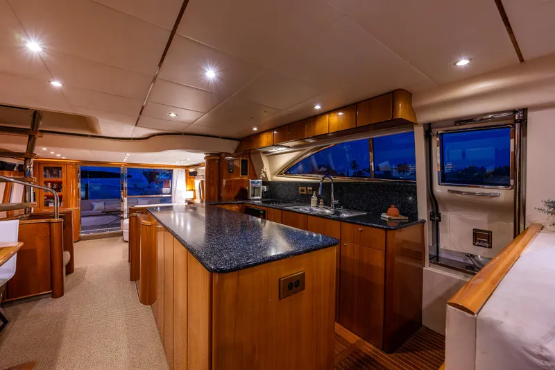 Slide: The Image of Luxurious interior of 2002 Viking Princess 72 SportCruiser yacht with modern kitchen. - 37