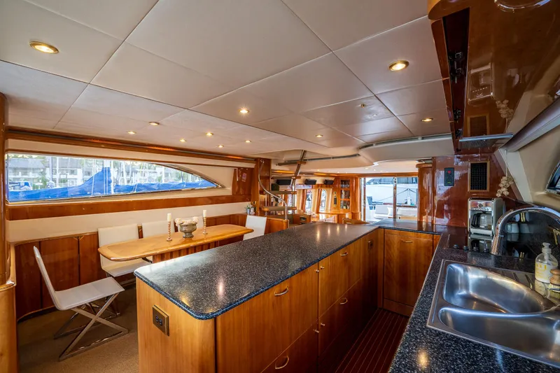 Slide: The Image of Interior of 2002 Viking Princess 72 SportCruiser yacht with modern kitchen and dining area. - 40