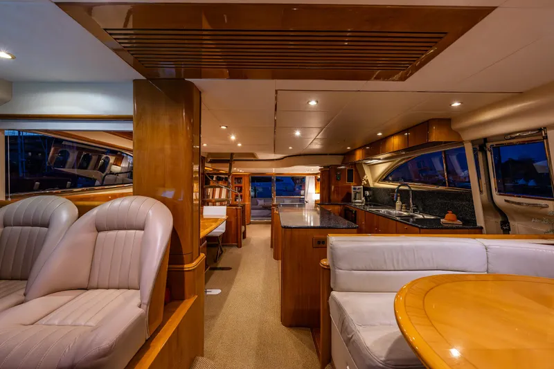 Slide: The Image of Luxurious interior of 2002 Viking Princess 72 SportCruiser yacht with modern kitchen and seating area. - 43