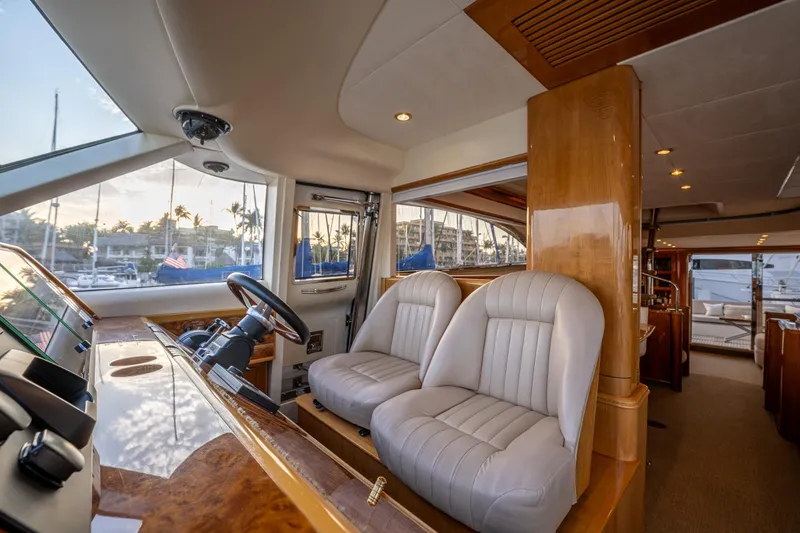 Slide: The Image of 2002 Viking Princess 72 SportCruiser interior with helm and leather seats. - 48