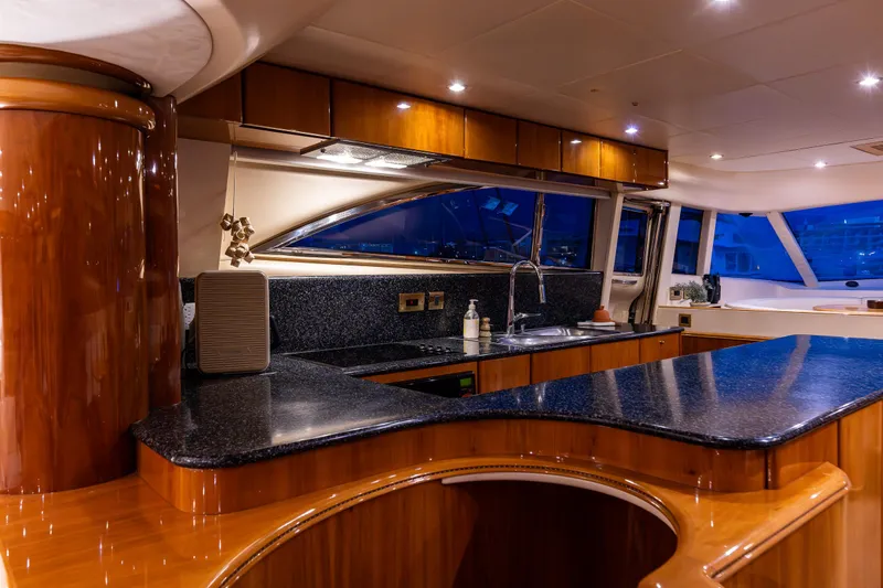 Slide: The Image of Luxurious kitchen interior of 2002 Viking Princess 72 SportCruiser yacht with sleek countertops. - 49